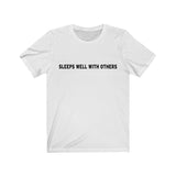 SLEEPS WELL WITH OTHERS - Unisex Soft Cotton T-shirt